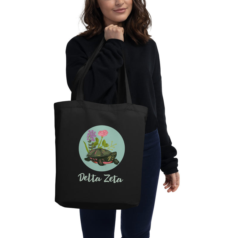 Delta Zeta Turtle Tote Bag in black shown on model&