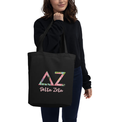 Delta Zeta Sorority Tote Bag with filled letters and sorority name on black bag on model's arm