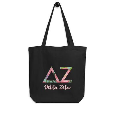 Delta Zeta Sorority Tote Bag in black shown hanging on a hook with filled letters