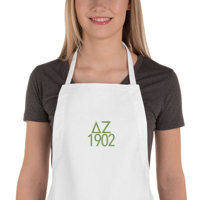 Delta Zeta Sorority Apron embroidered in green on white apron shown close up