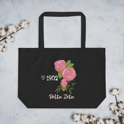 Delta Zeta 1902 Sorority Tote Bag in black shown flat with cotton blossoms