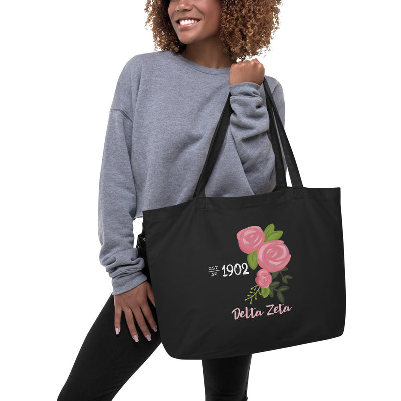 Delta Zeta 1902 Sorority Tote Bag shown in black on model with 1902 design.