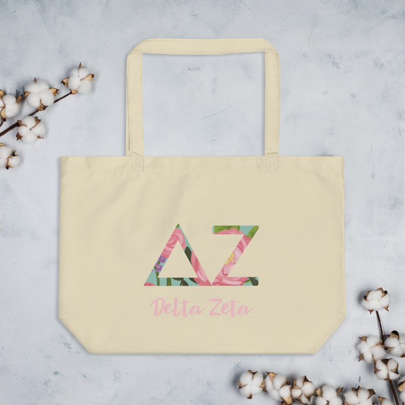 Delta Zeta Sorority Tote Bag in natural oyster shown flat with cotton blossoms