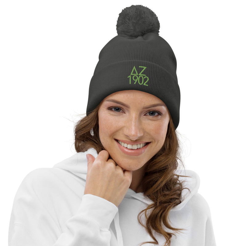 Delta Zeta Sorority Beanie in graphite gray with green embroidery shown on model