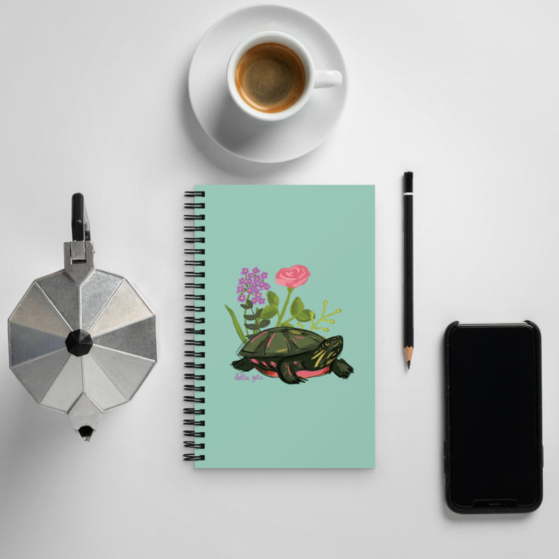 Delta Zeta Sorority Notebook in green with turtle mascot design shown in lifestyle setting