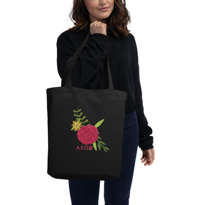 Alpha Chi Omega Eco Tote Bag Red Carnation Design in black shown on woman's arm