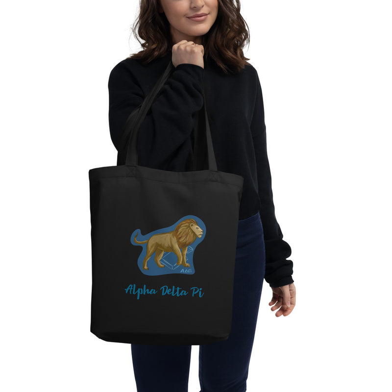 Alpha Delta Pi Alphie the Lion Eco Tote Bag shown in black on woman&