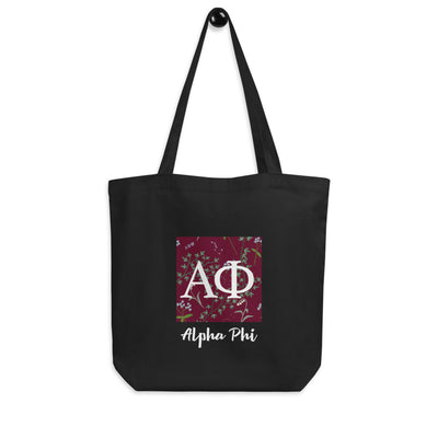 Alpha Phi Greek Letters Eco Tote Bag in black shown on a hook