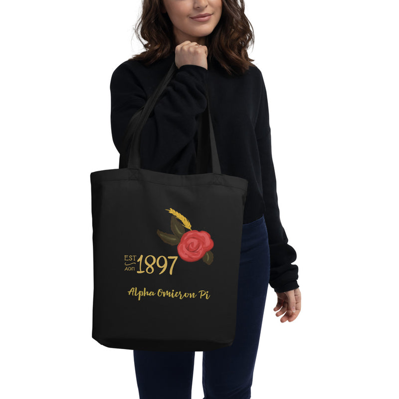 Alpha Omicron Pi 1897 Founders Day Eco Tote Bag in black on woman&