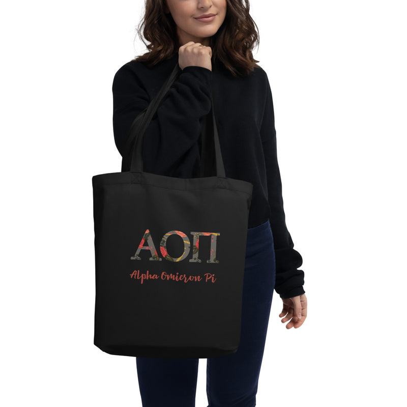Alpha Omicron Pi Greek Letters Eco Tote Bag in black on model&