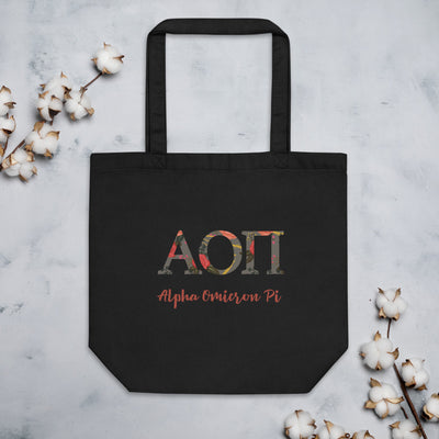 Alpha Omicron Pi Greek Letters Eco Tote Bag in black shown with cotton