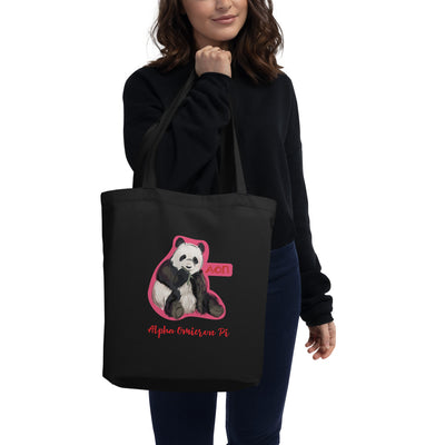 Alpha Omicron Pi Panda Eco Tote Bag shown in black on model's arm
