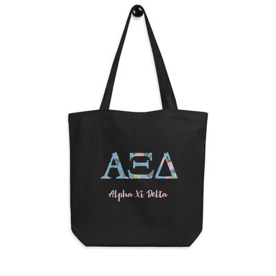 Alpha Xi Delta Greek Letters Eco Tote Bag in black on a hook