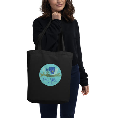 Tri Delta Pansy and Poseidon Eco Tote Bag shown on model in black
