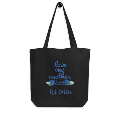 Tri Delta Love One Another Eco Tote Bag in black shown on hook