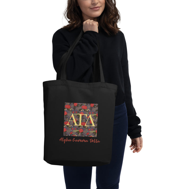 Alpha Gamma Delta Greek Letters Eco Tote Bag in black on model&