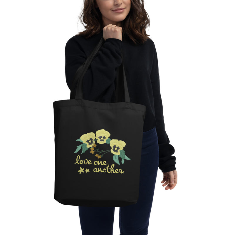 Kappa Alpha Theta Love One Another Eco Tote Bag in black on model
