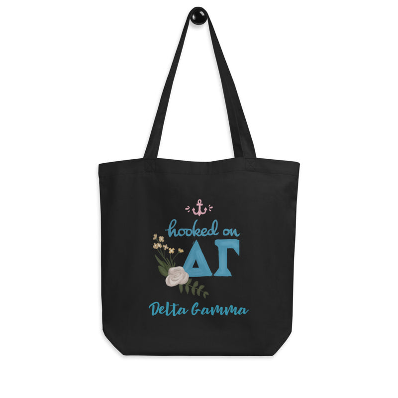 Delta Gamma Hooked on DG Eco Tote Bag shown in black on hook
