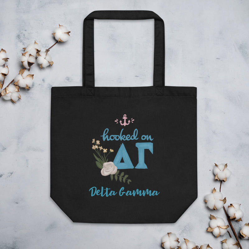 Delta Gamma Hooked on DG Eco Tote Bag shown in black with cotton blossoms