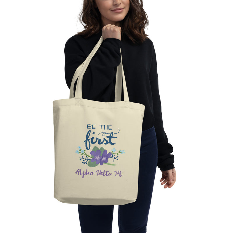 Alpha Delta Pi Be The First Eco Tote Bag shown in natural oyster color on woman&