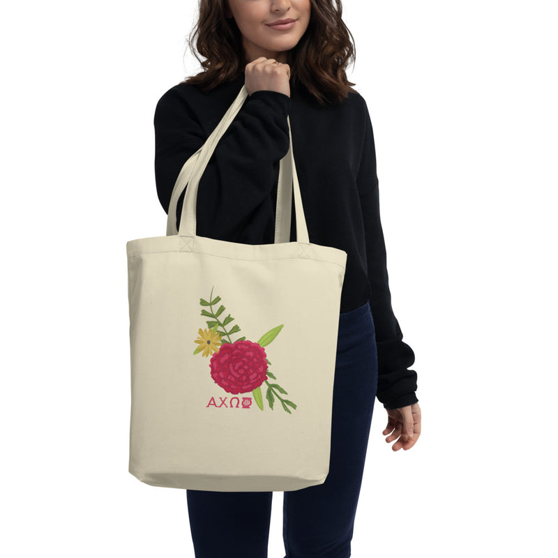Alpha Chi Omega Eco Tote Bag Red Carnation Design shown on woman&