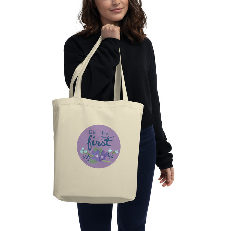 Alpha Delta Pi Be The First Large Organic Eco Tote Bag in natural oyster shown on woman&