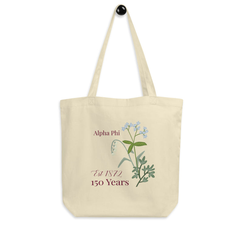 Alpha Phi 150th Anniversary Eco Tote Bag shown on a hook