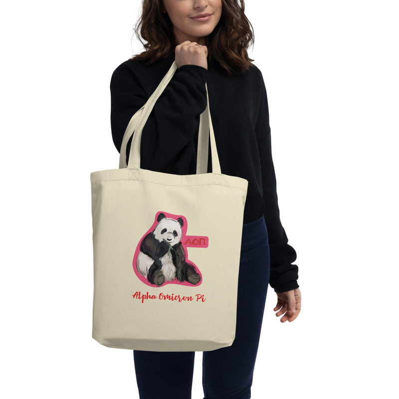 Alpha Omicron Pi Panda Eco Tote Bag shown in natural on model&