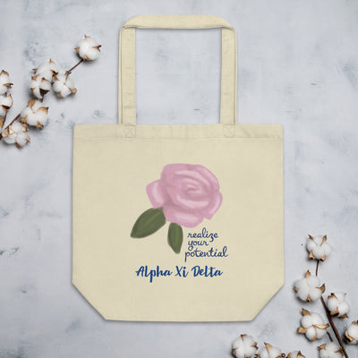 Alpha Xi Delta Realize Your Potential Eco Tote Bag shown with cotton