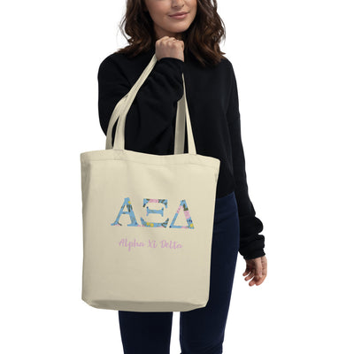 Alpha Xi Delta Greek Letters Eco Tote Bag in natural oyster on model's arm