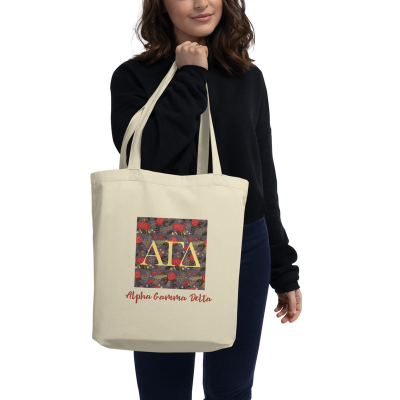 Alpha Gamma Delta Greek Letters Eco Tote Bag in natural oyster on model&