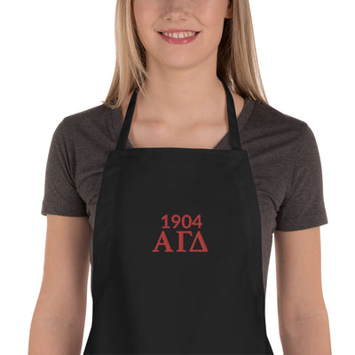 Alpha Gamma Delta 1904 Founding Year Embroidered Apron in close up view on model