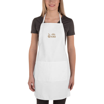 Alpha Chi Omega 1885 Lyre Embroidered Apron in full view on young woman