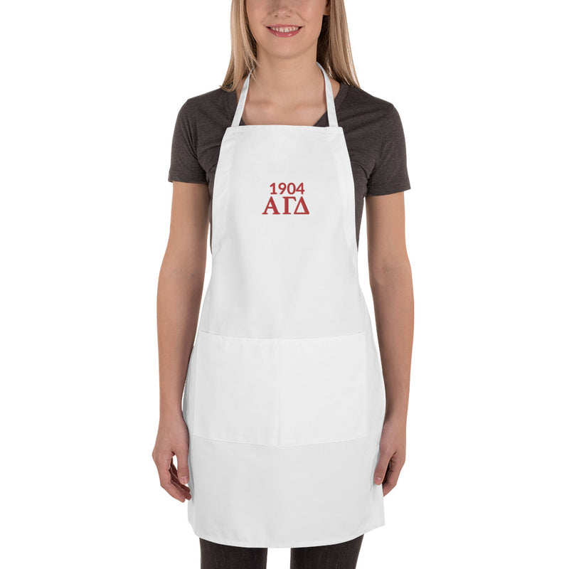 Alpha Gamma Delta 1904 Founding Year Embroidered Apron in white in full view shown on model