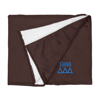 Tri Delta Plush Embroidered Sherpa Blanket in brown flat