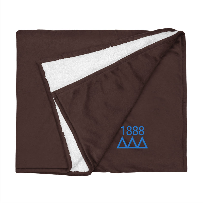 Tri Delta Plush Embroidered Sherpa Blanket in brown flat