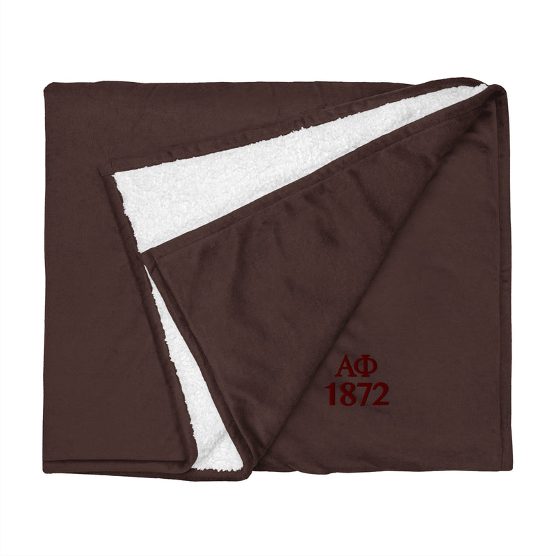 Alpha Phi Plush Embroidered Sherpa Blanket in brown flat