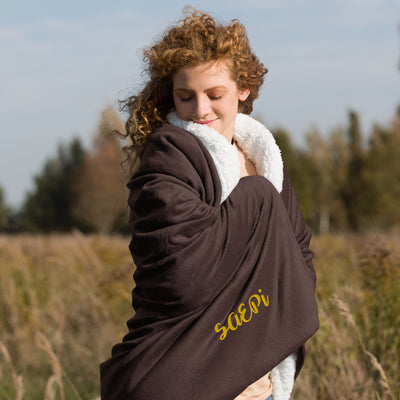 Sigma Alpha Epsilon Pi Embroidered Sherpa Blanket in brown on model