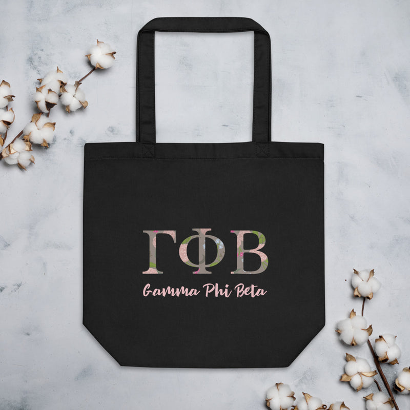 Gamma Phi Beta Sorority Letters Tote Bag shown in black with cotton blossoms