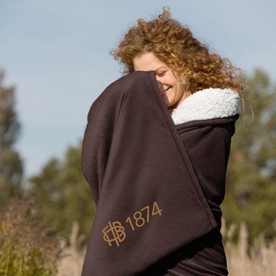 Gamma Phi Beta Plus Embroidered Sherpa Blanket in brown on model