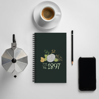 Kappa Delta 1897 Spiral Notebook shown with coffee setting 