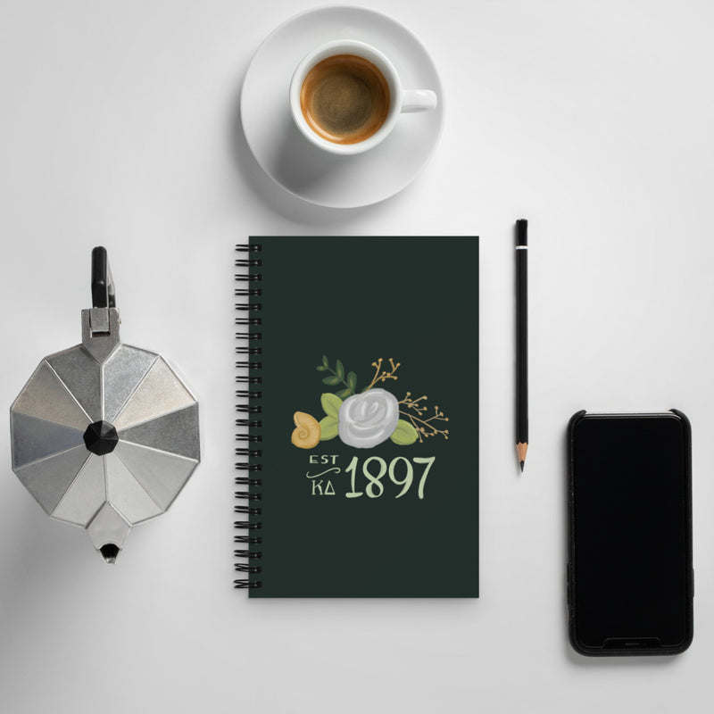 Kappa Delta 1897 Spiral Notebook shown with coffee setting 
