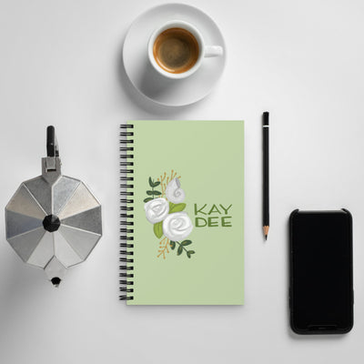 Kappa Delta Kay Dee Spiral Notebook shown with coffee