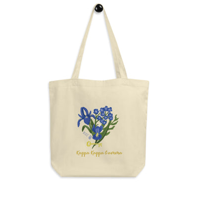Kappa Kappa Gamma Fleur de Key design on a natural oyster color tote bag shown hanging on a hook 