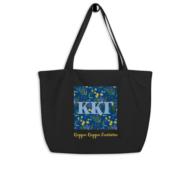 Kappa Kappa Gamma Letters tote with Fleur de Lis floral print shown hanging on a hook 