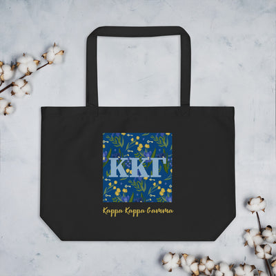 Kappa Kappa Gamma Letters large tote bag in black shown flat with cotton blossoms