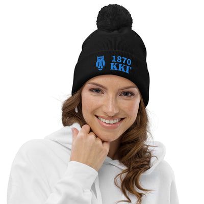 Kappa Kappa Gamma 1870 Pom Pom Beanie in black embroidered with founding year, letters and owl symbol shown on model