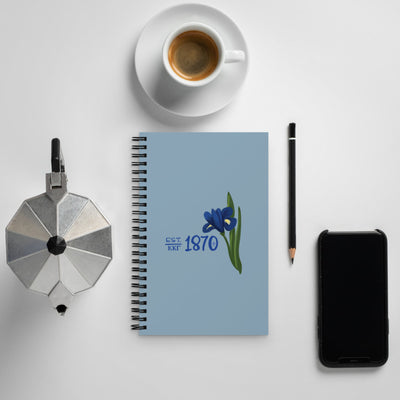 Kappa Kappa Gamma Sorority Spiral Notebook in blue shown in lifestyle setting with 1870 design on front