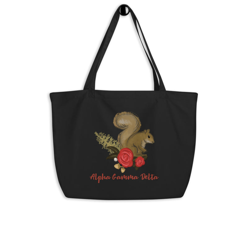 Alpha Gamma Delta Squirrel Mascot Large Organic Eco Tote Bag shown in black on a hook
