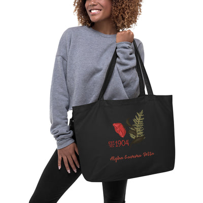 Alpha Gamma Delta 1904 Founders Day Large Organic Tote Bag in black on model's arm